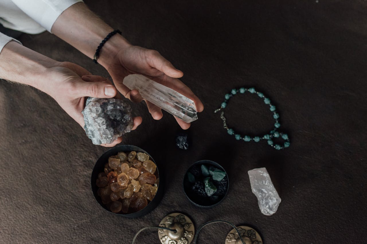 Offerings Close-up of hands holding various healing crystals for alternative therapy and meditation.